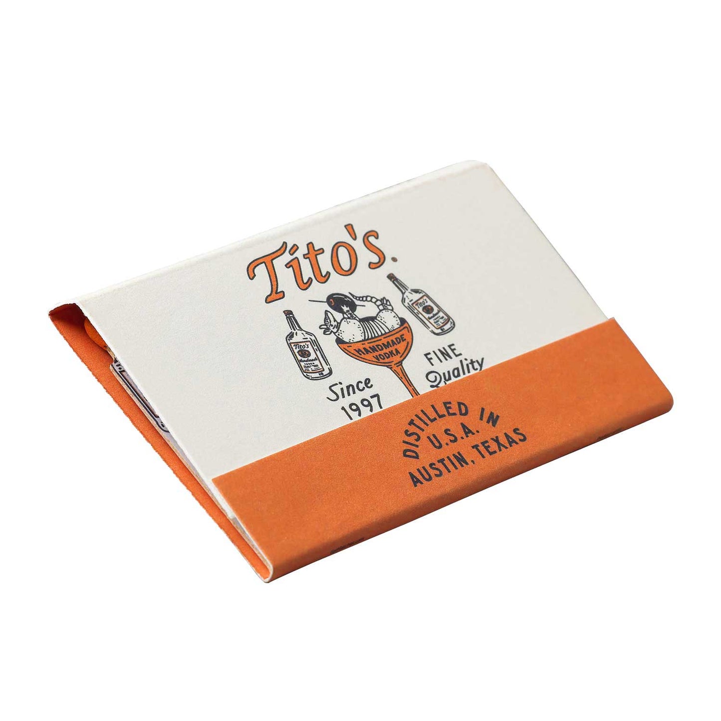 Front image of a closed Tito's Handmade Vodka branded matchbook with orange and white design of and armadillo holding an olive in a martini glass.