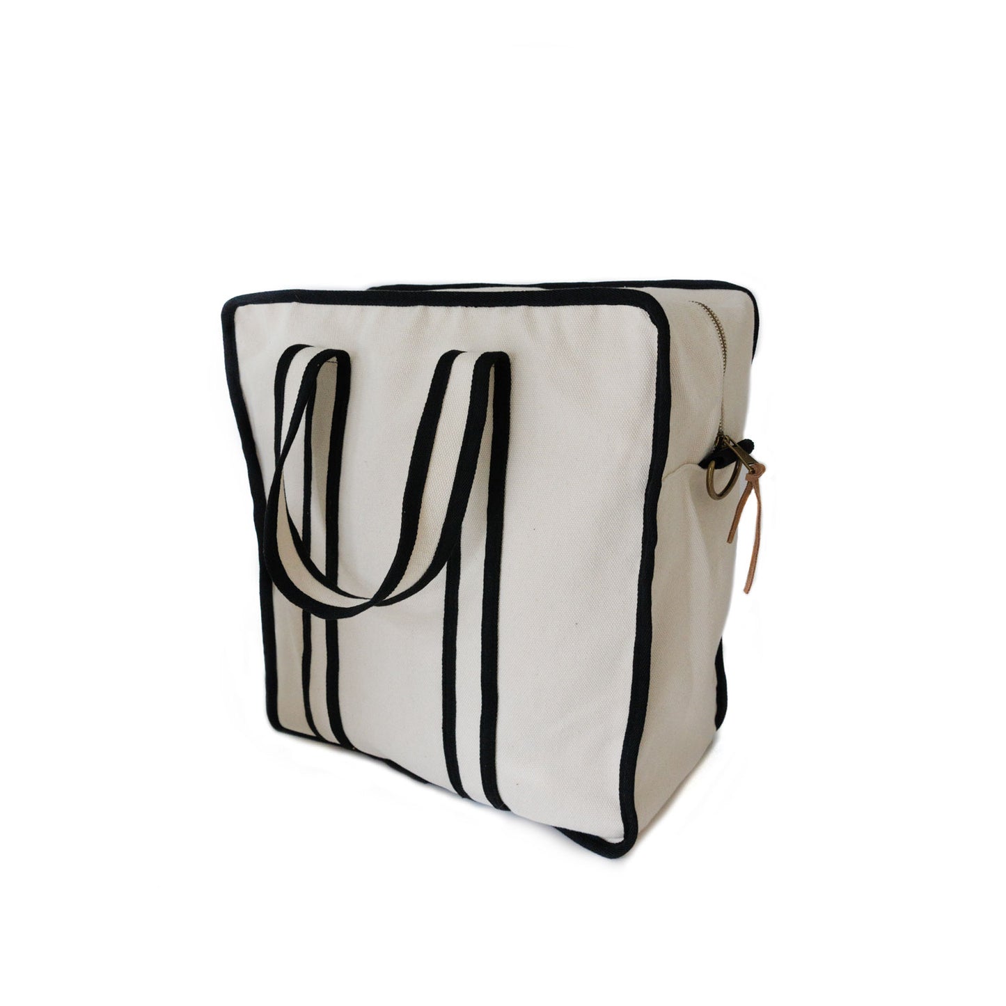 Back of cream color Tito's X Tangerine Pickleball Bag with black trim
