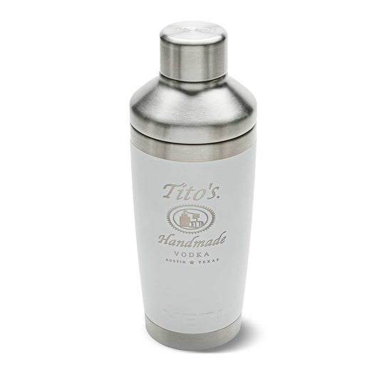 Front of white YETI Cocktail shaker with Tito's Handmade Vodka logo etched on and stainless steel cap