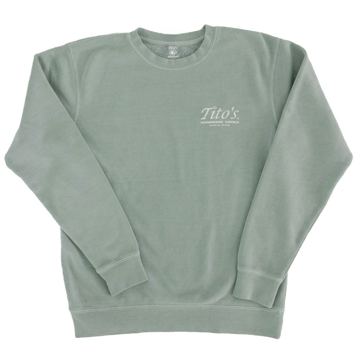 Front of sage green crewneck pullover with Tito's Handmade Vodka and Austin, Texas badge