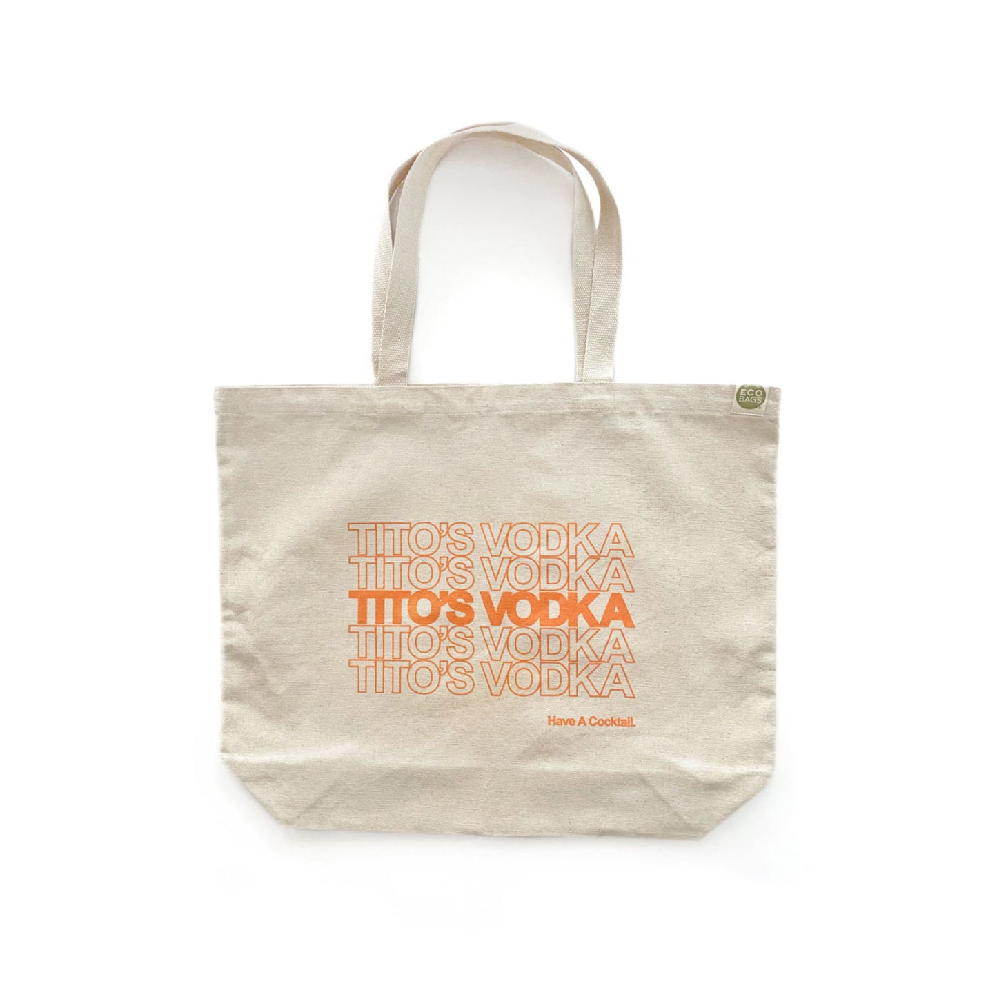 A beige cotton tote bag with the text 'Tito's Vodka' printed in orange.
