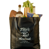 Black Tito's Tote bag filled with a Tito's Handmade Vodka bottle, football, snacks, cups and bloody mary mix