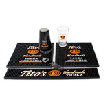 Kit includes: 1 Tito's rail mat, 2 Tito's square mats, one Tito's bottle opener, and one Tito's shaker and pint glass set