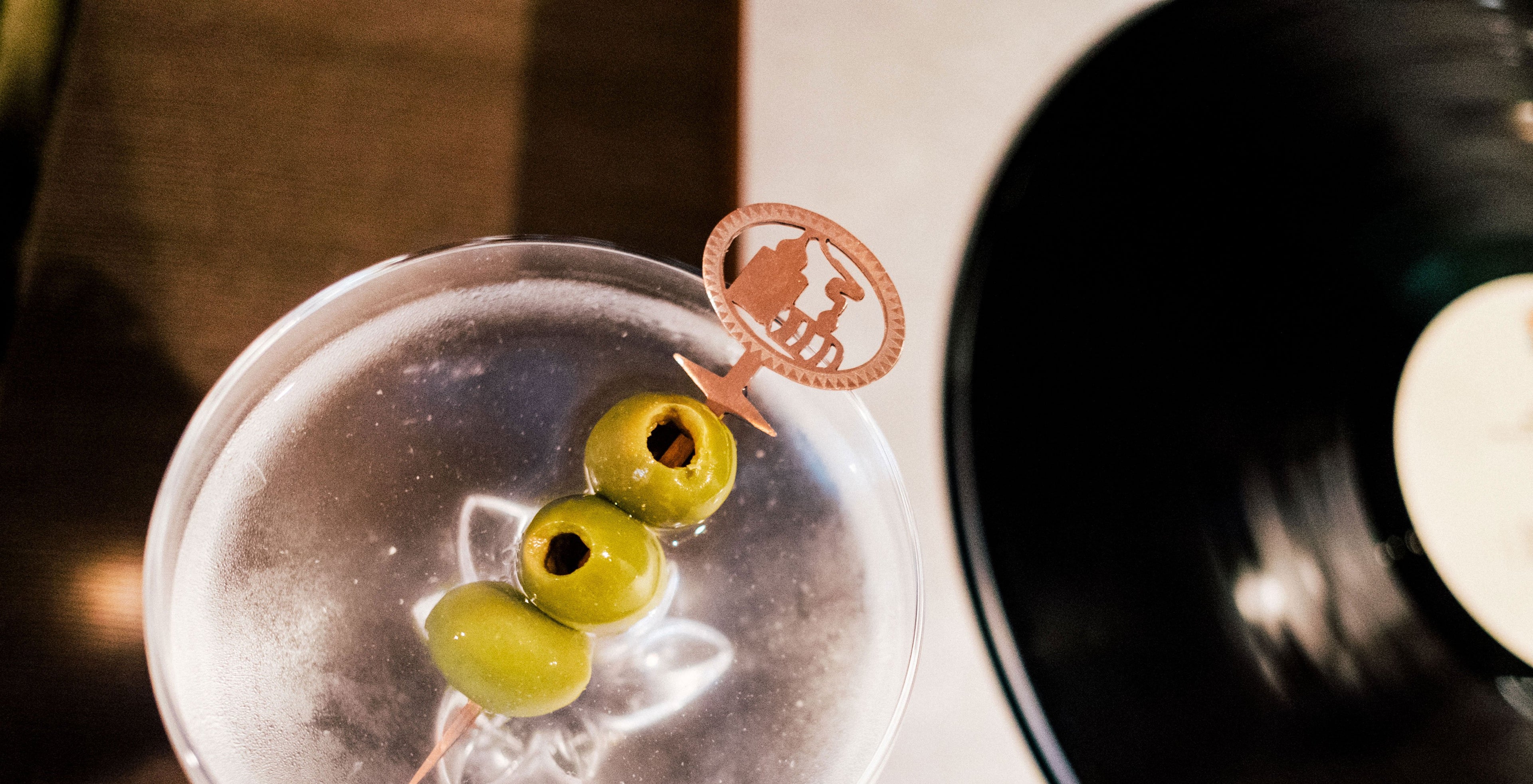 Tito's martini with a garnish pick