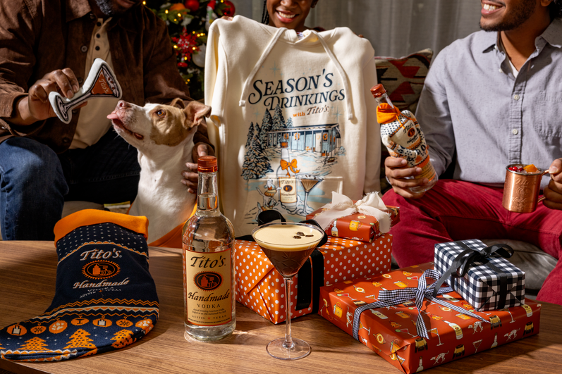 A holiday scene with the ingredients for the Tito's Holiday Thyme cocktail.