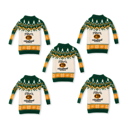 Five green and orange sweaters for vodka bottles with Tito's Handmade Vodka logo in the middle and festive designs 