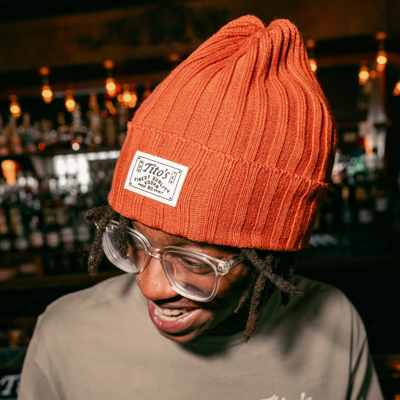 Person wearing Tito's Copper Beanie in a bar 
