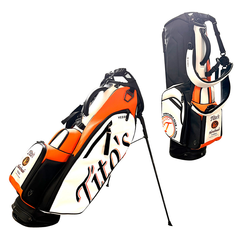 Tito's golf bag with black, orange, and white leather with Tito's branding on different pockets
