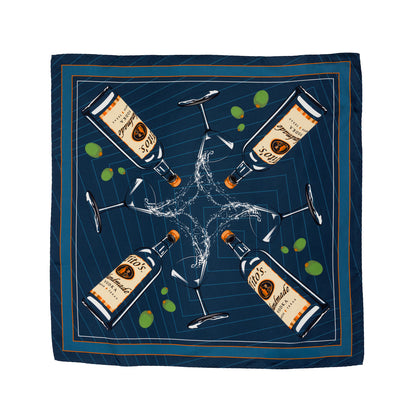 Blue silk scarf with a design of Tito's Handmade Vodka bottles and martini glasses overflowing with olives