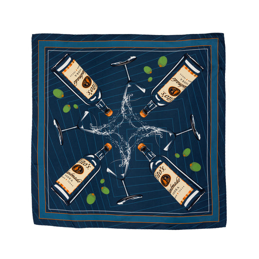 Blue silk scarf with a design of Tito's Handmade Vodka bottles and martini glasses overflowing with olives