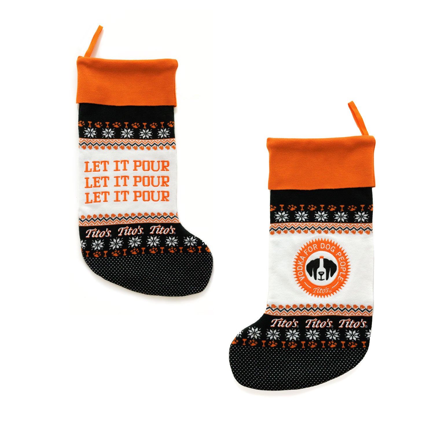 Front and back of black, white, and orange stocking with let it pour text, Vodka for Dog People logo, Tito's wordmark, and designs of snowflakes, paw prints, and martini glasses