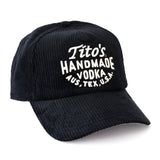 Front View of Black corduroy hat with Tito's Handmade Vodka Aus, Tex, U.S.A. stitched on in white.