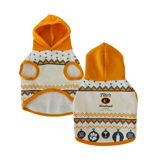 Front and back view of cream dog hoodie with orange hood and blue ornaments printed with paw print, martini, bottle, and snowflakes with Tito's Handmade Vodka logo in the center of sweater