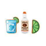 Front view of Tito's Bottle Toy with Tito's Handmade Vodka logo, Tito's Puptail squeeze toy, and Tito's Squeeze lime toy