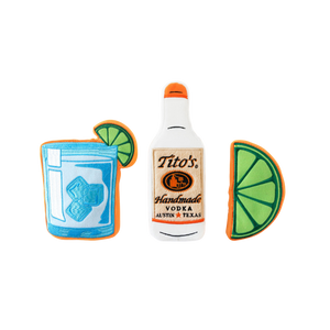 Front view of Tito's Bottle Toy with Tito's Handmade Vodka logo, Tito's Puptail squeeze toy, and Tito's Squeeze lime toy