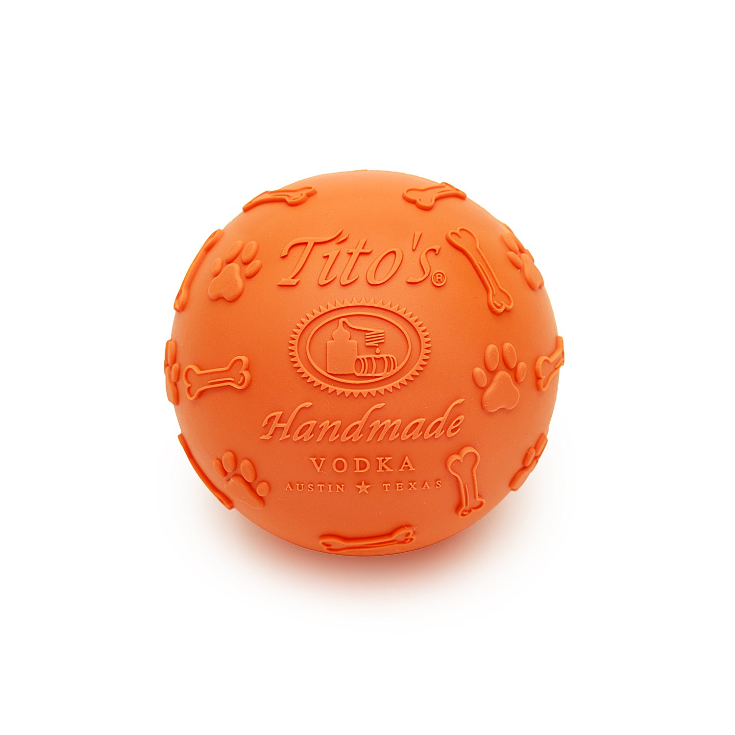 Orange rubber ball with Tito's Handmade Vodka logo and paw print and dog bone designs