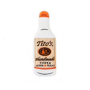 Squeaky, floatable dog toy that looks like a Tito's bottle