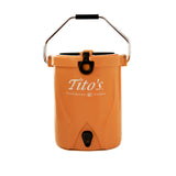 Front of orange Brümate BackTap with Tito's Handmade Vodka wordmark, carry handle, and pour spout