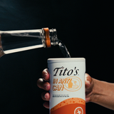 Tito's Handmade Vodka pouring into Tito's in Any* Can
