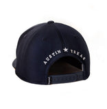 Back of navy snapback hat with Austin, Texas embroidery