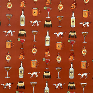 Rust colored wrapping paper with illustrations of cocktails, dogs, and Tito's Handmade Vodka bottles