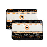 Black, orange, and white blanket with Vodka for Dog People logo, Tito's wordmark, and designs of martinis, snowflakes, and dog paws