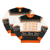 Front and back view of black, orange, and white pullover with snowflake designs, martinis, paw prints, Tito's wordmark, Let It Pour text, and Vodka for Dog People logo