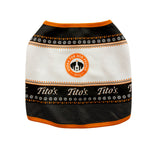 Front view of black, orange, and white pullover with snowflakes, paw prints, martinis, with Tito's wordmark and Vodka for Dog People logo