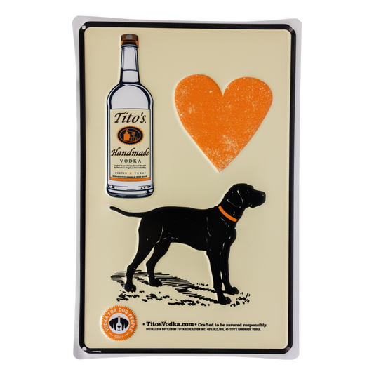 8" X 12" metal embossed sign designed with Tito's bottle, orange heart, black dog, and Tito's Vodka for Dog People logo