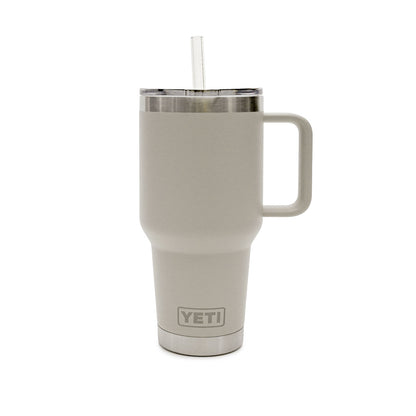 A YETI 35 oz handled travel tumbler in light gray with a stainless steel rim, a clear lid, and a clear straw, shown on a white background.