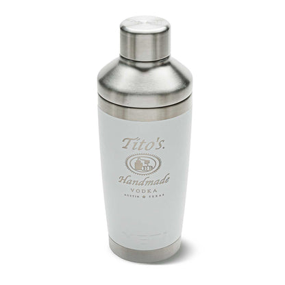 Front of white YETI Cocktail shaker with Tito's Handmade Vodka logo etched on and stainless steel cap