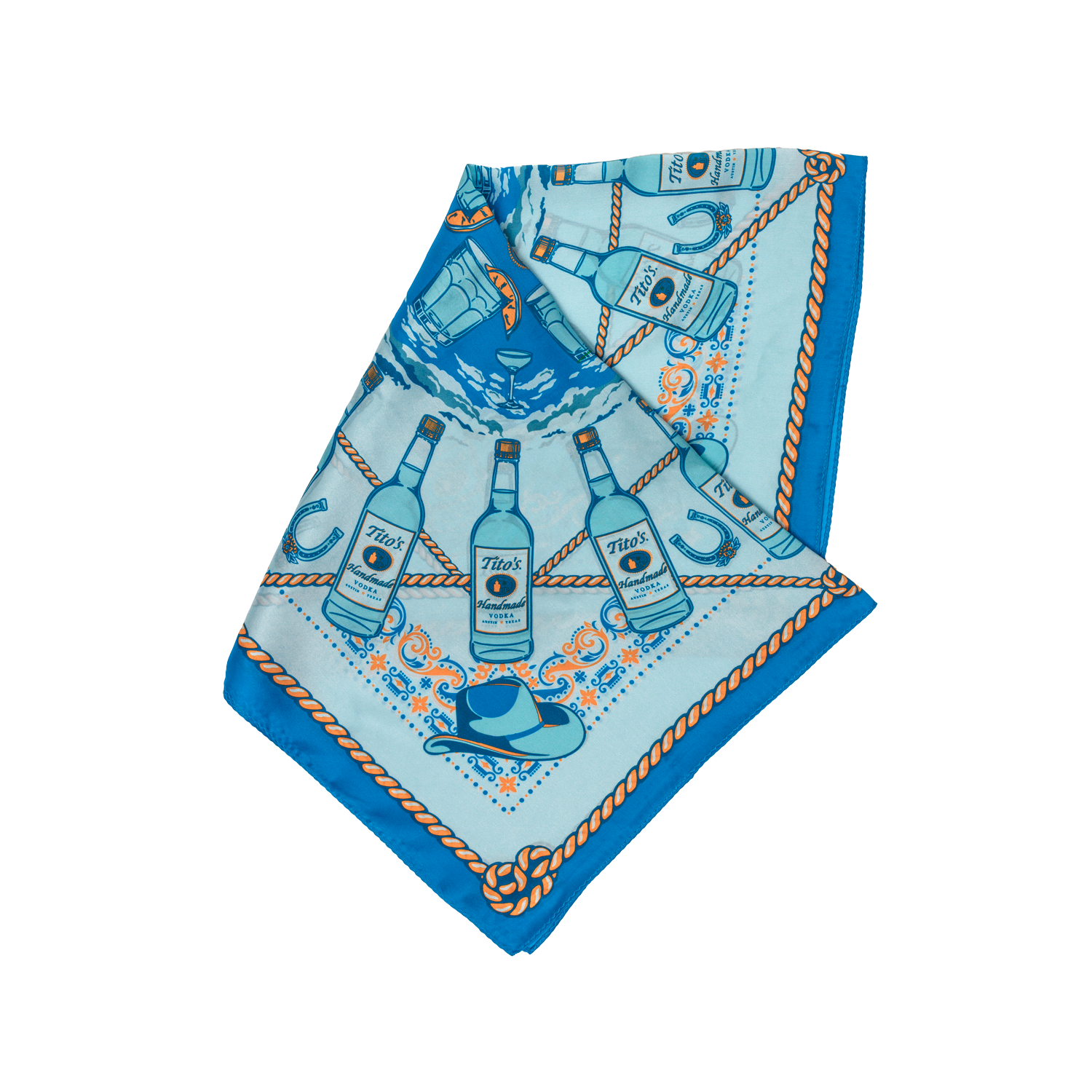 Blue silk scarf with pattern of Tito's Handmade Vodka bottles, cowboy hats, cocktails, and rope folded into a triangle