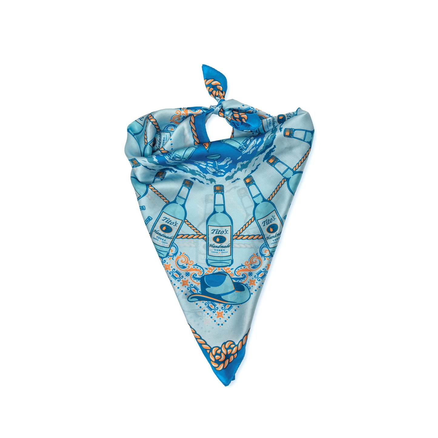 Blue silk scarf with pattern of Tito's Handmade Vodka bottles, cowboy hats, cocktails, and rope tied like a bandana
