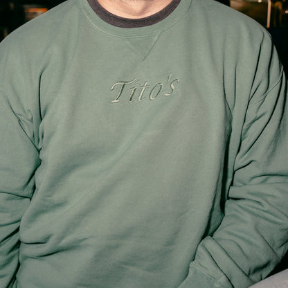 Person wearing the evergreen colored Tito's Classic Crewneck 