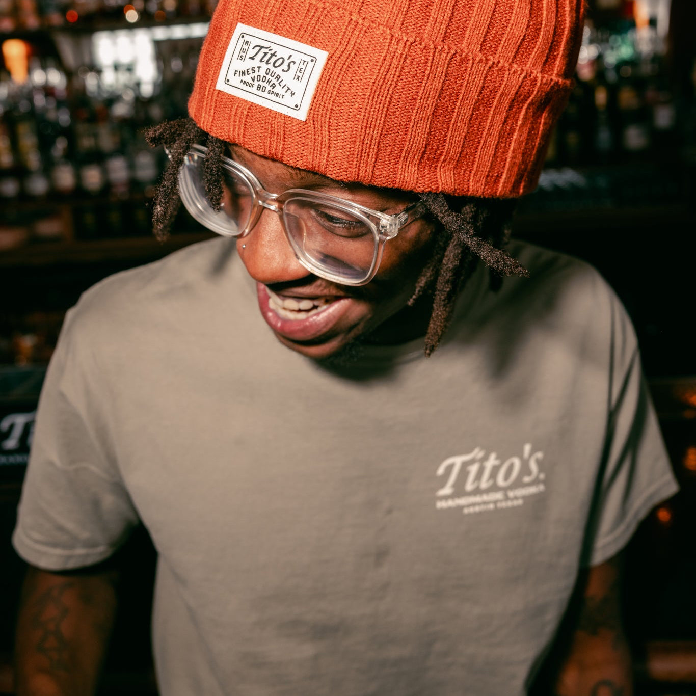 Person wearing Tito's Copper Beanie and Tito's Hometown Tee- front logo 