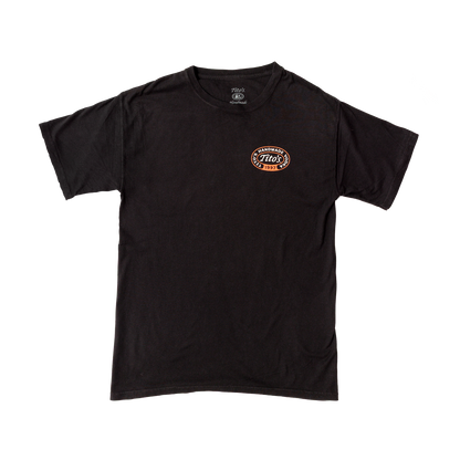 Front view of a black shirt with orange and white lettering- has a circle logo with Tito's in the center and Tito's Handmade Vodka 1997 around it. 