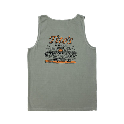 Back view of mens sandstone colored tank top with artwork of a guy and his dog on a paddle board with Tito's Handmade Vodka text above it.