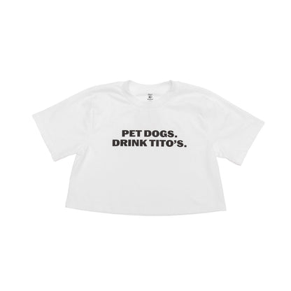 White crop shirt with black text 'PET DOGS, DRINK TITO'S' 