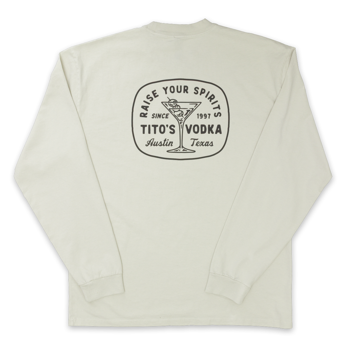 Back view of bone colored longsleeve with design of a martini glass with olives and says Raise Your Spirits, Tito's Vodka, Austin, Texas Since 1997