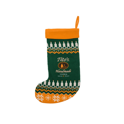 Green and orange Christmas stocking with Tito's Handmade Vodka logo and festive designs
