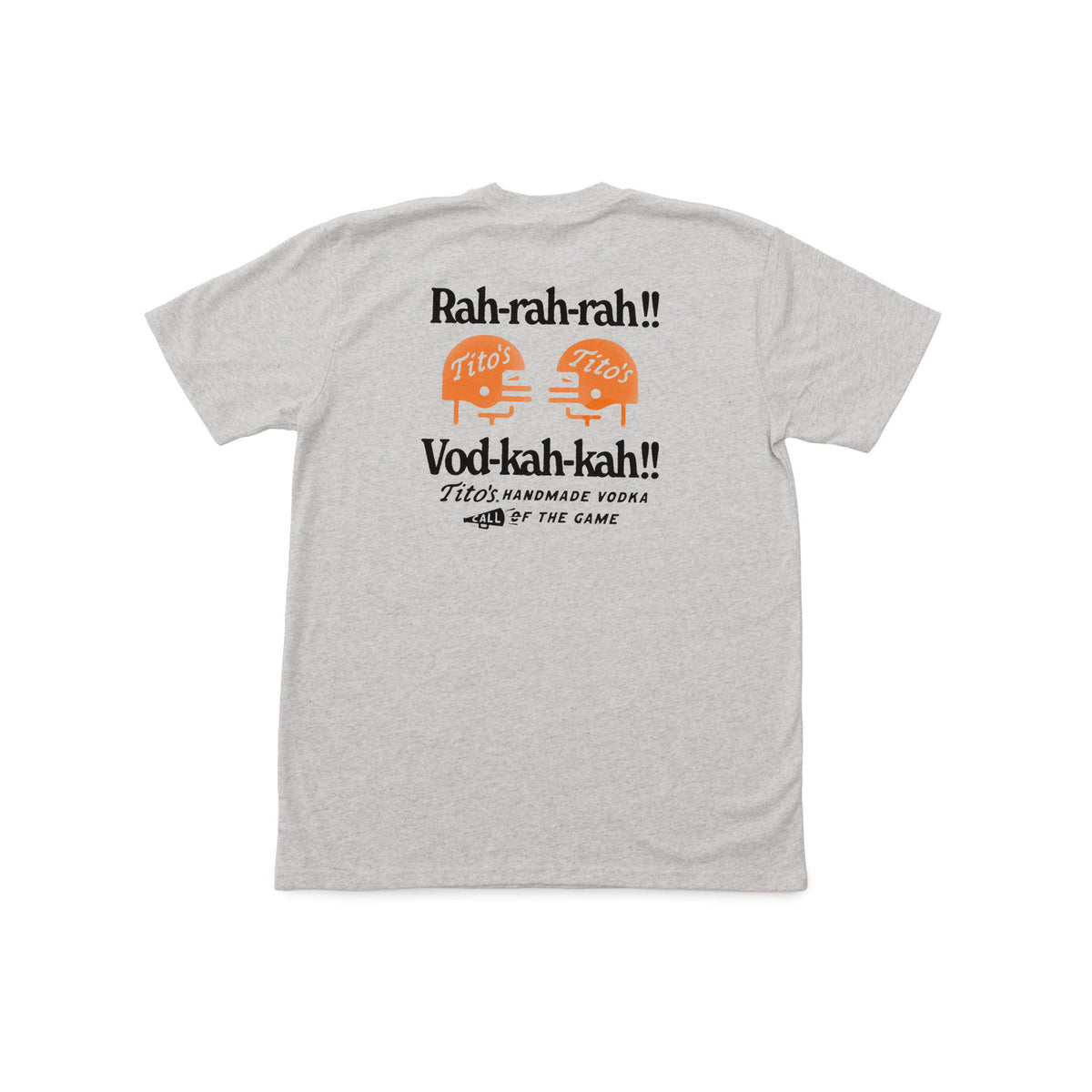 A light heather gray t-shirt shown from the back, featuring a graphic print with the text 'Rah-rah-rah!!' and 'Vod-kah-kah!!' in black, along with two orange illustrations of football helmets labeled 'Tito's'.