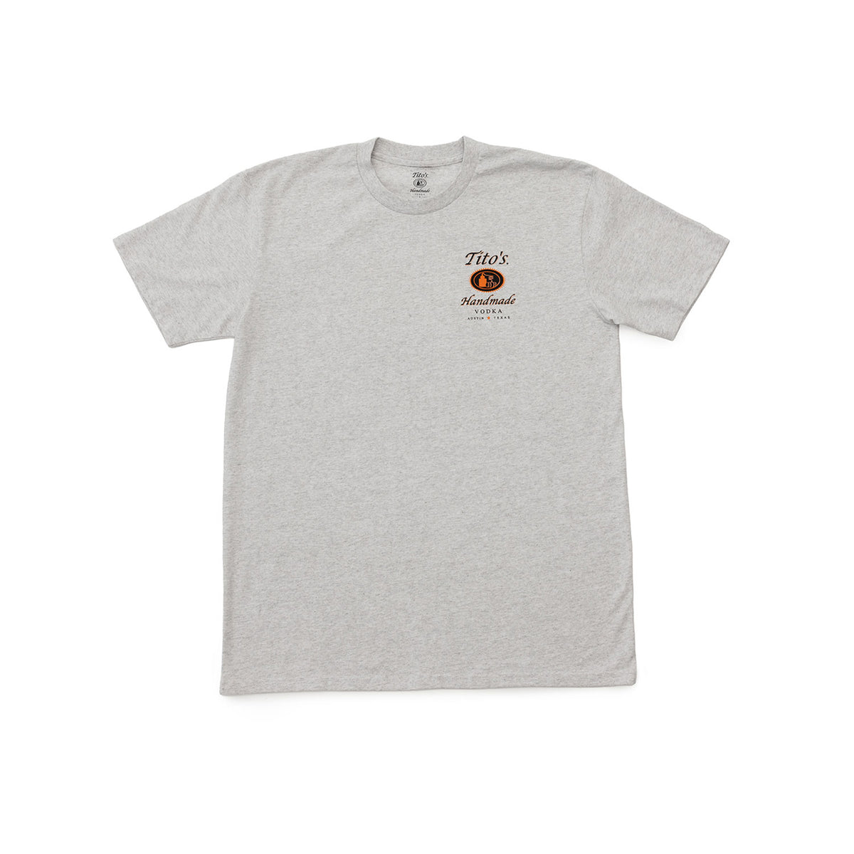 A light heather gray short-sleeve t-shirt with a Tito's Handmade Vodka logo on the left chest in black and orange. 