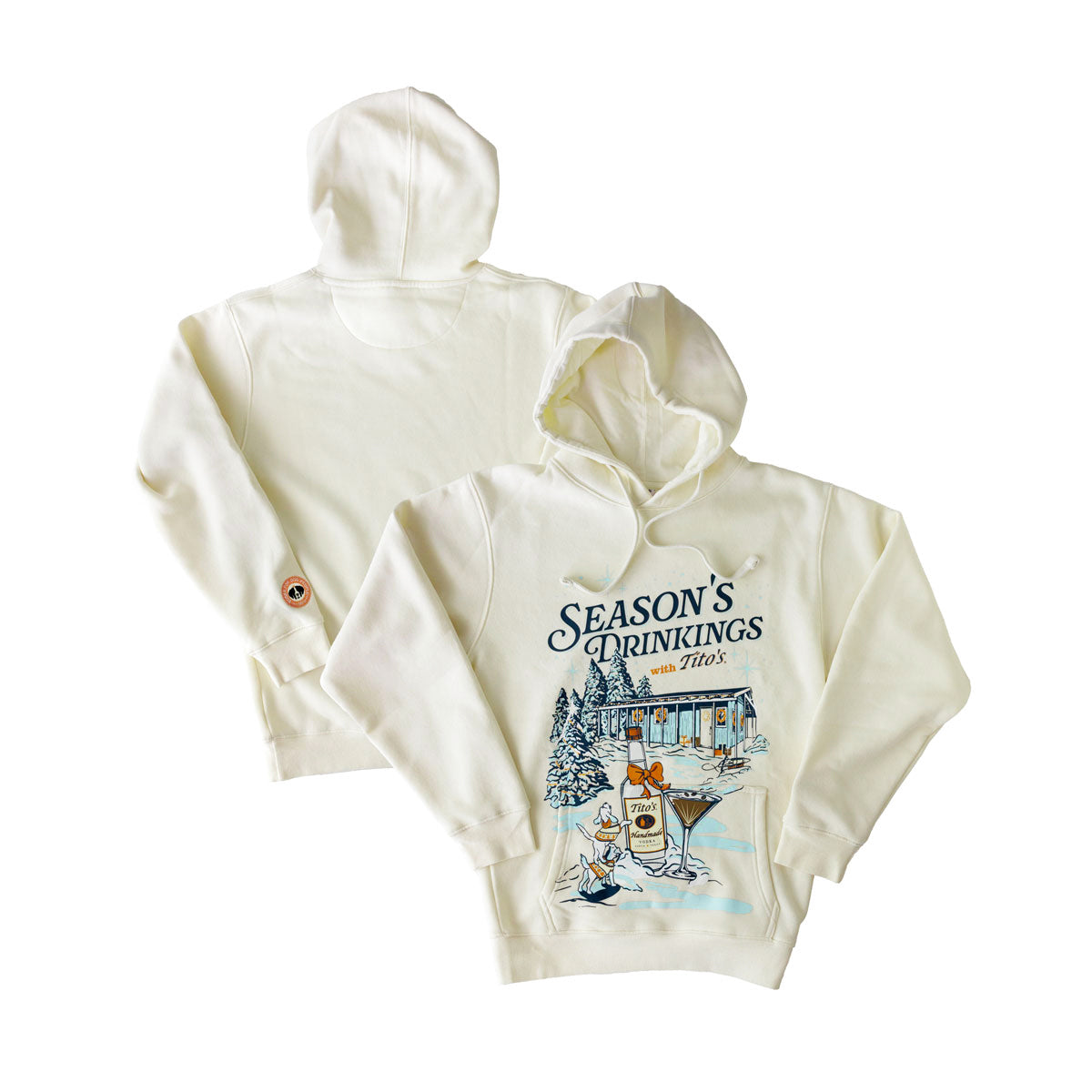 Front and back view of cream hoodie with Season's Drinkings with Tito's text, a picture of the Mockingbird Distillery and trees covered in snow, with two dogs, a Tito's bottle with a bow, and espresso martini, with Vodka For Dog People logo on left sleeve