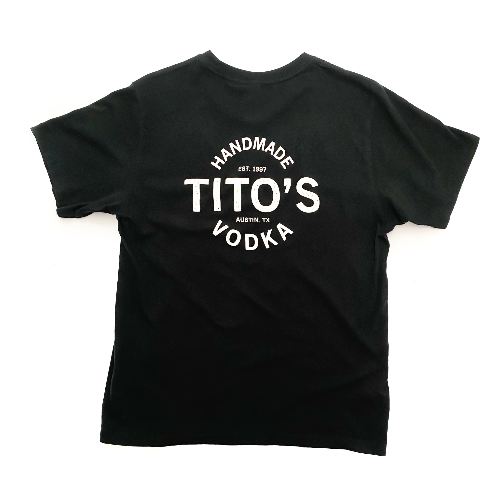 Back of black short-sleeved t-shirt with large design of Tito's Handmade Vodka, est. 1997, and Austin, TX