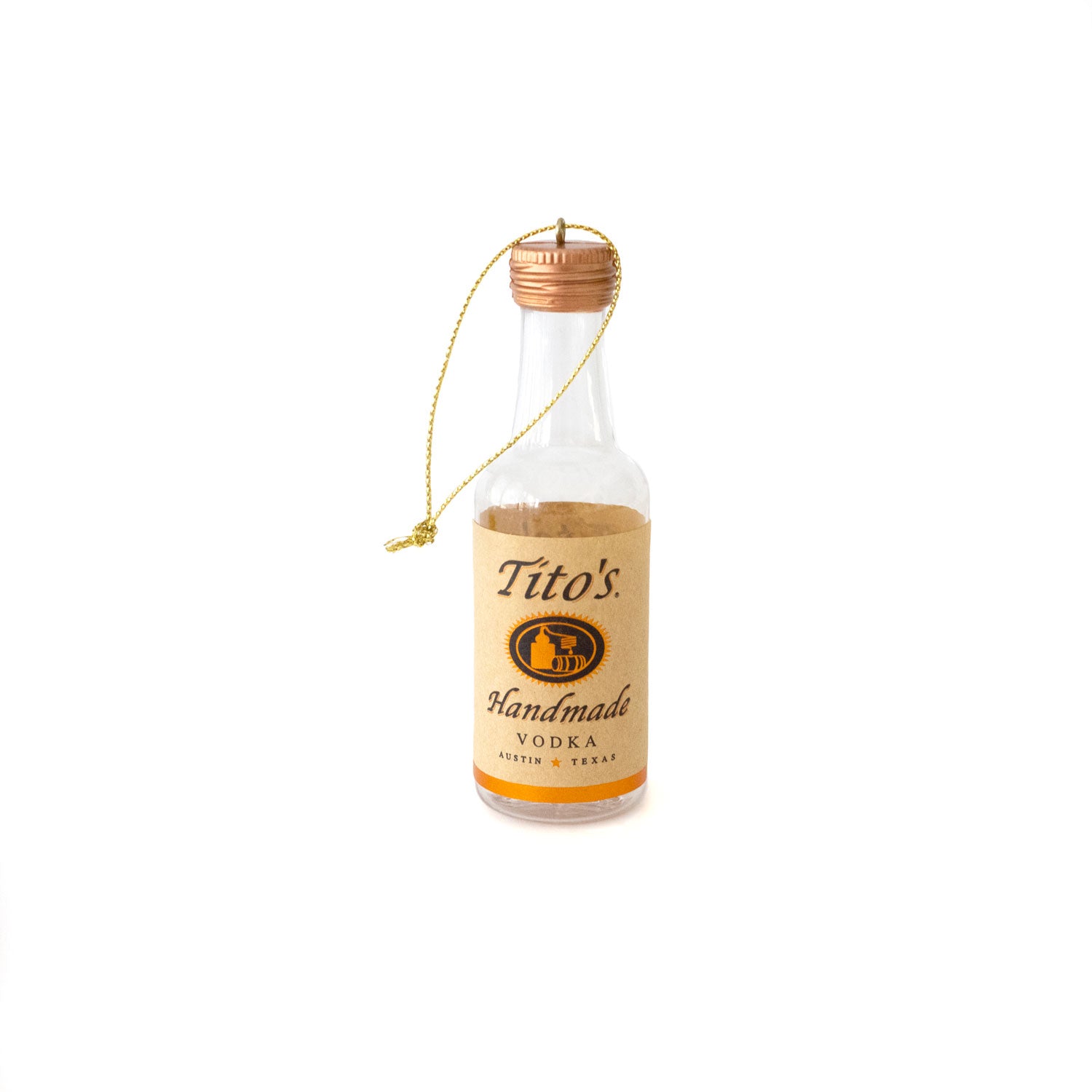 Empty plastic 50 mL bottle of Tito's Handmade Vodka on a gold thread hanger