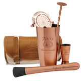 Copper mixology kit includes canvas and leather travel satchel, muddler, shaker, strainer, jigger, and bar spoon with Tito's logos