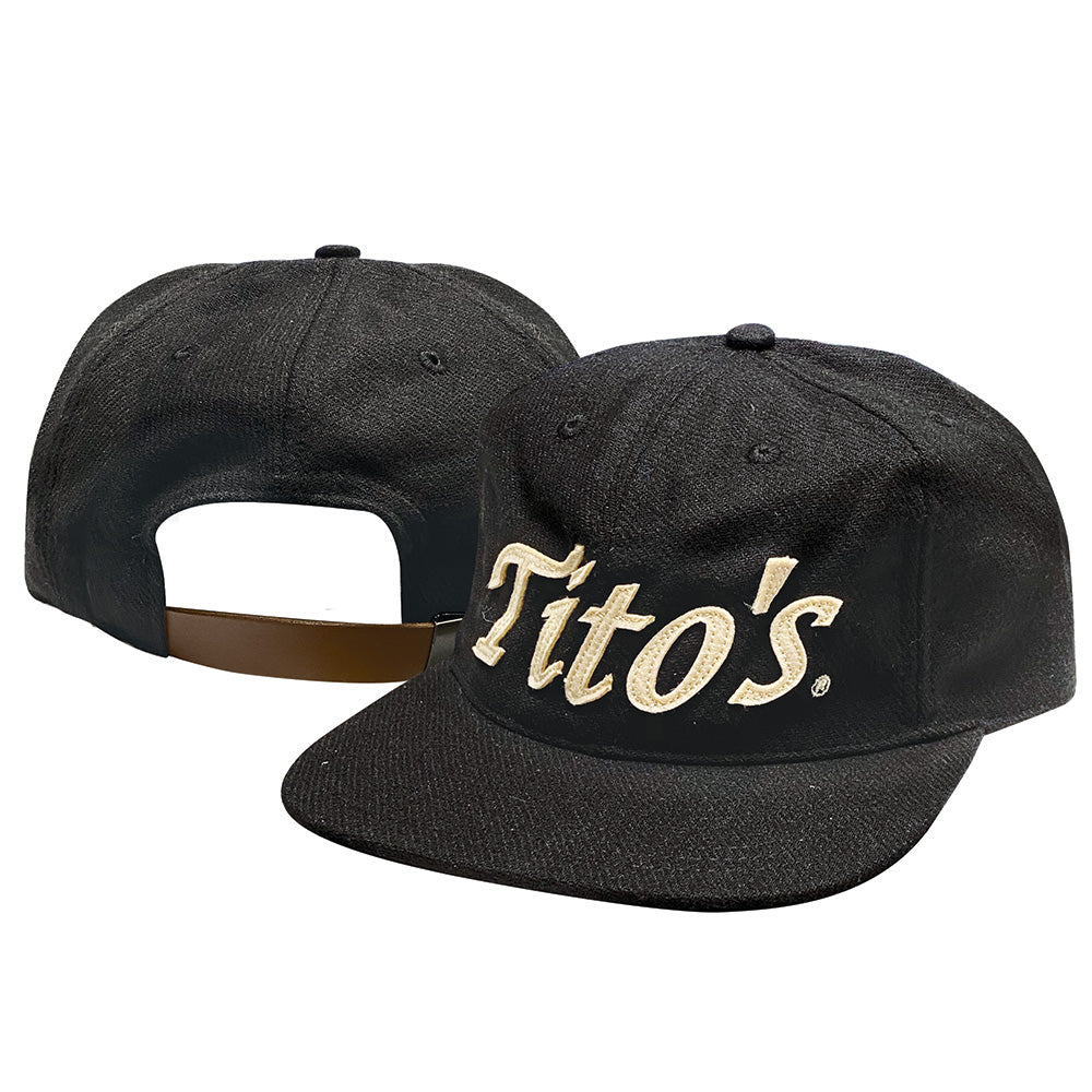  Front and back view of black wool hat with Tito's wordmark appliqué in creamy white felt