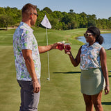 Woman wearing Tito's X William Murray Bottle in Disguise Golf Polo Tank cheersing a man wearing the Tito's X William Murray Men's Transfusion Golf Polo