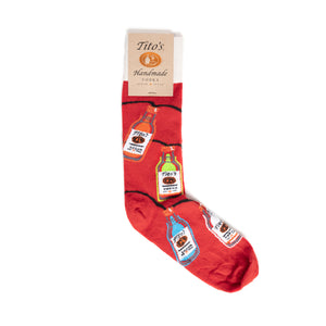 Red socks with white cuffs and design of Tito's bottles as colorful string lights