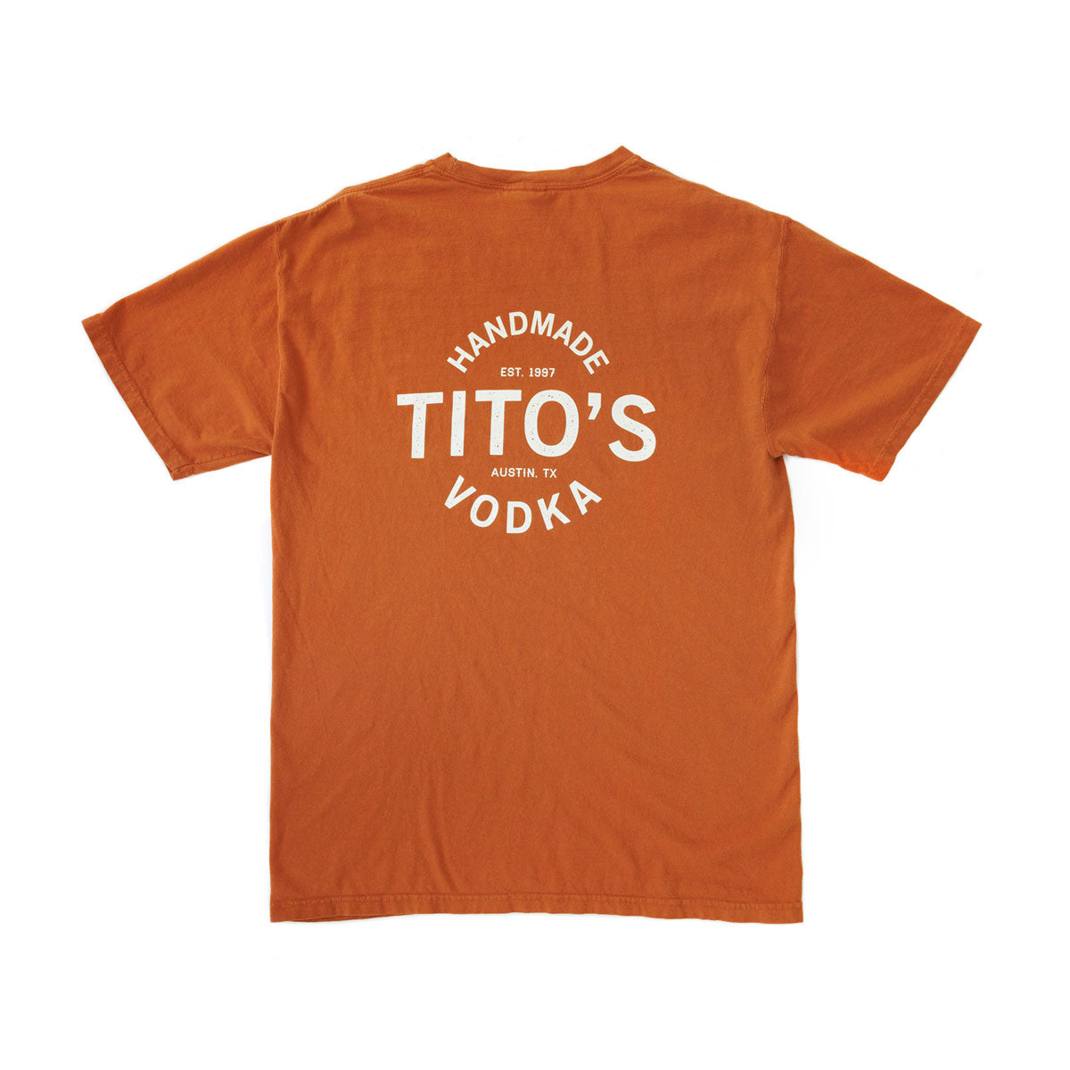 Back of orange short-sleeved t-shirt with large design of Tito's Handmade Vodka, est. 1997, and Austin, TX